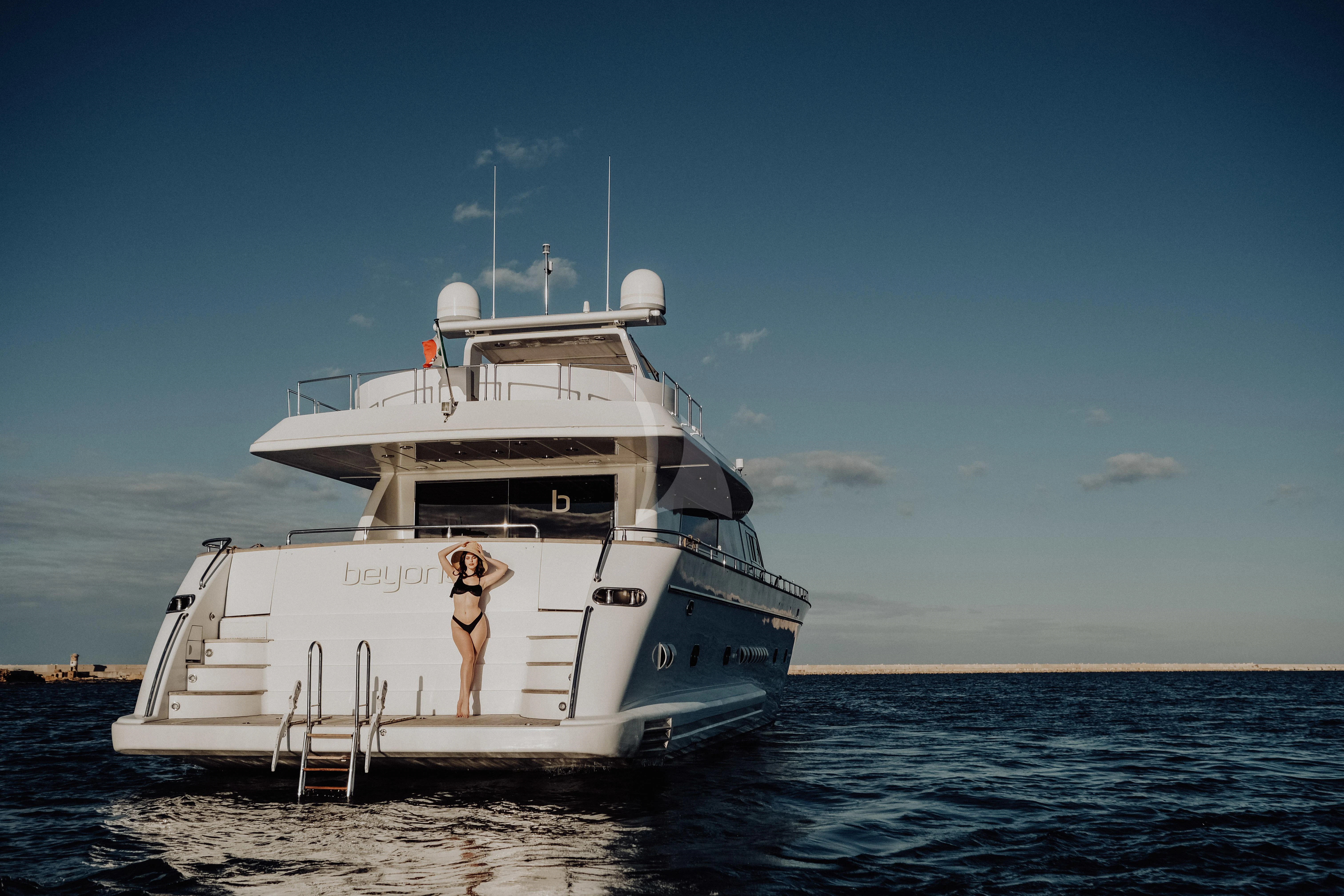 a person standing on a boat aboard BEYOND Yacht for Charter