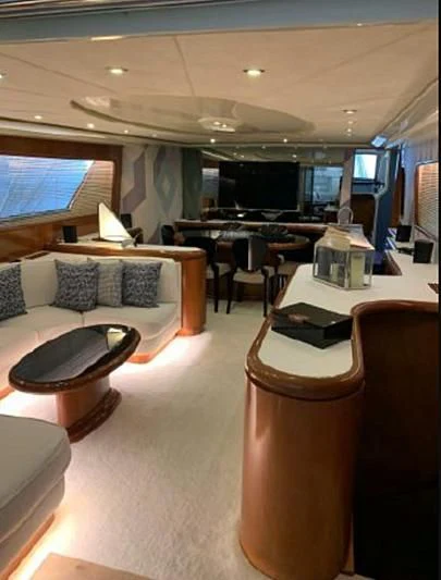 a living room with a couch and a table aboard BEYOND Yacht for Charter