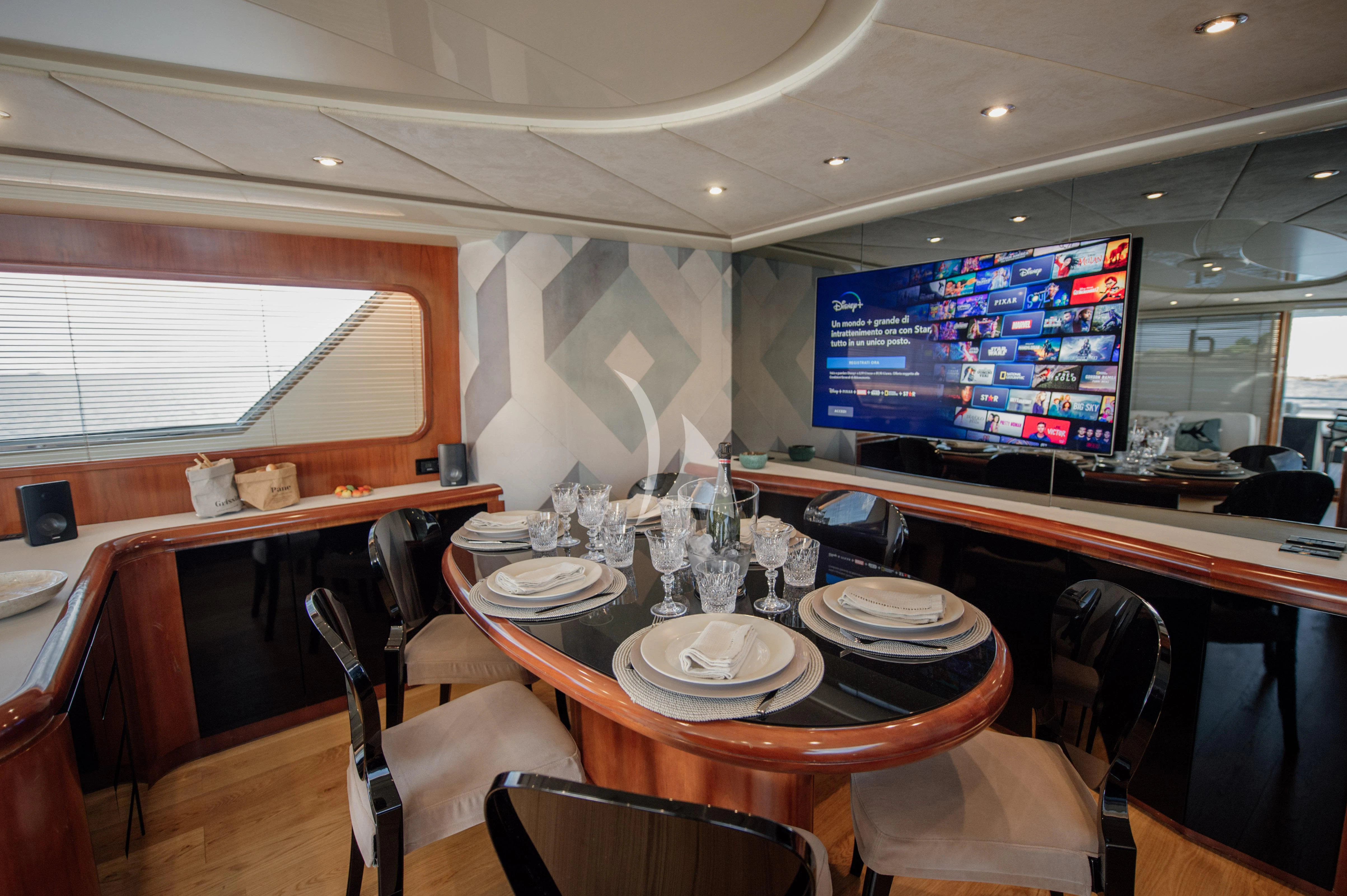 a restaurant with a table and chairs aboard BEYOND Yacht for Charter