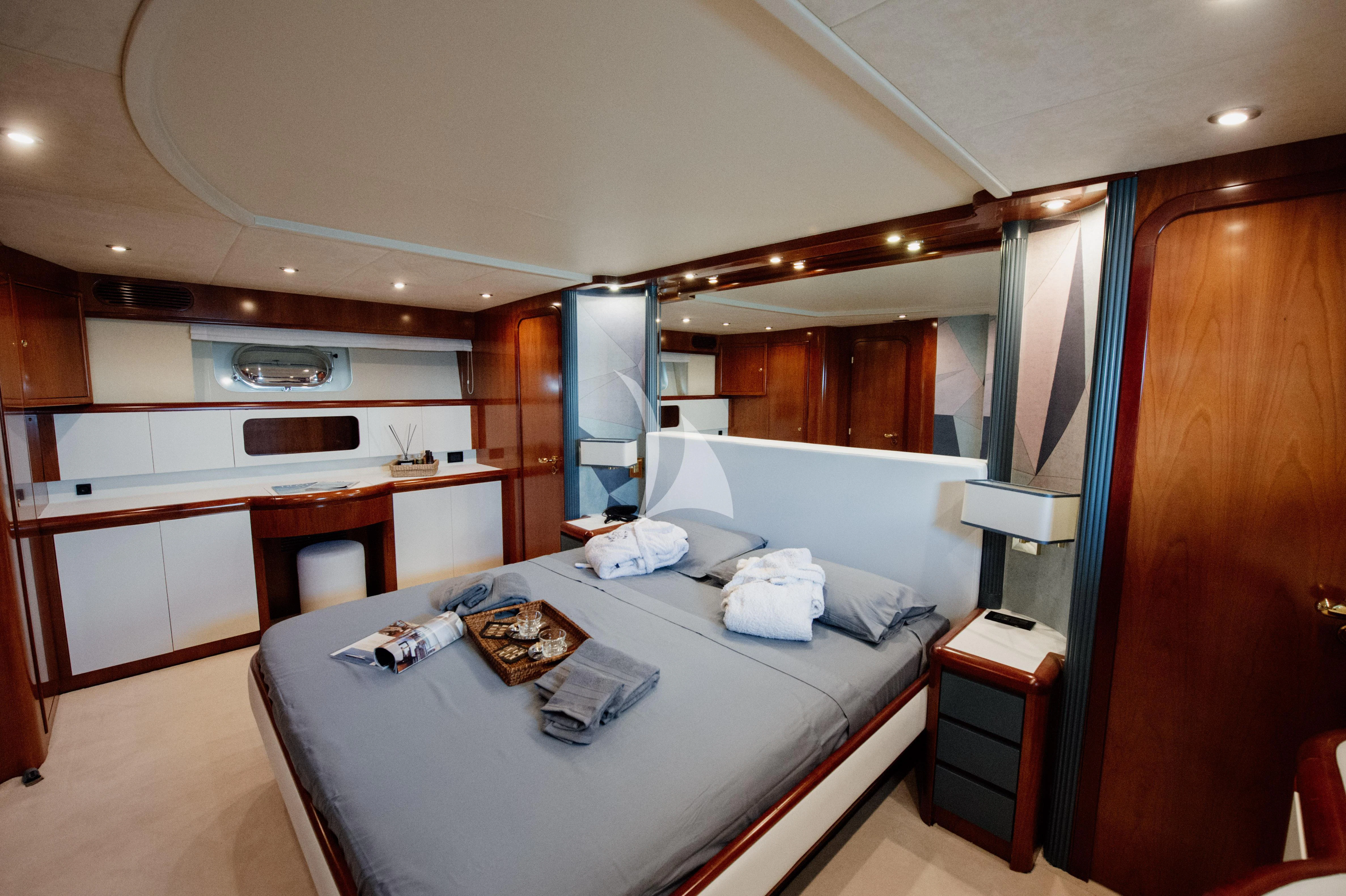 a hotel room with a bed aboard BEYOND Yacht for Charter