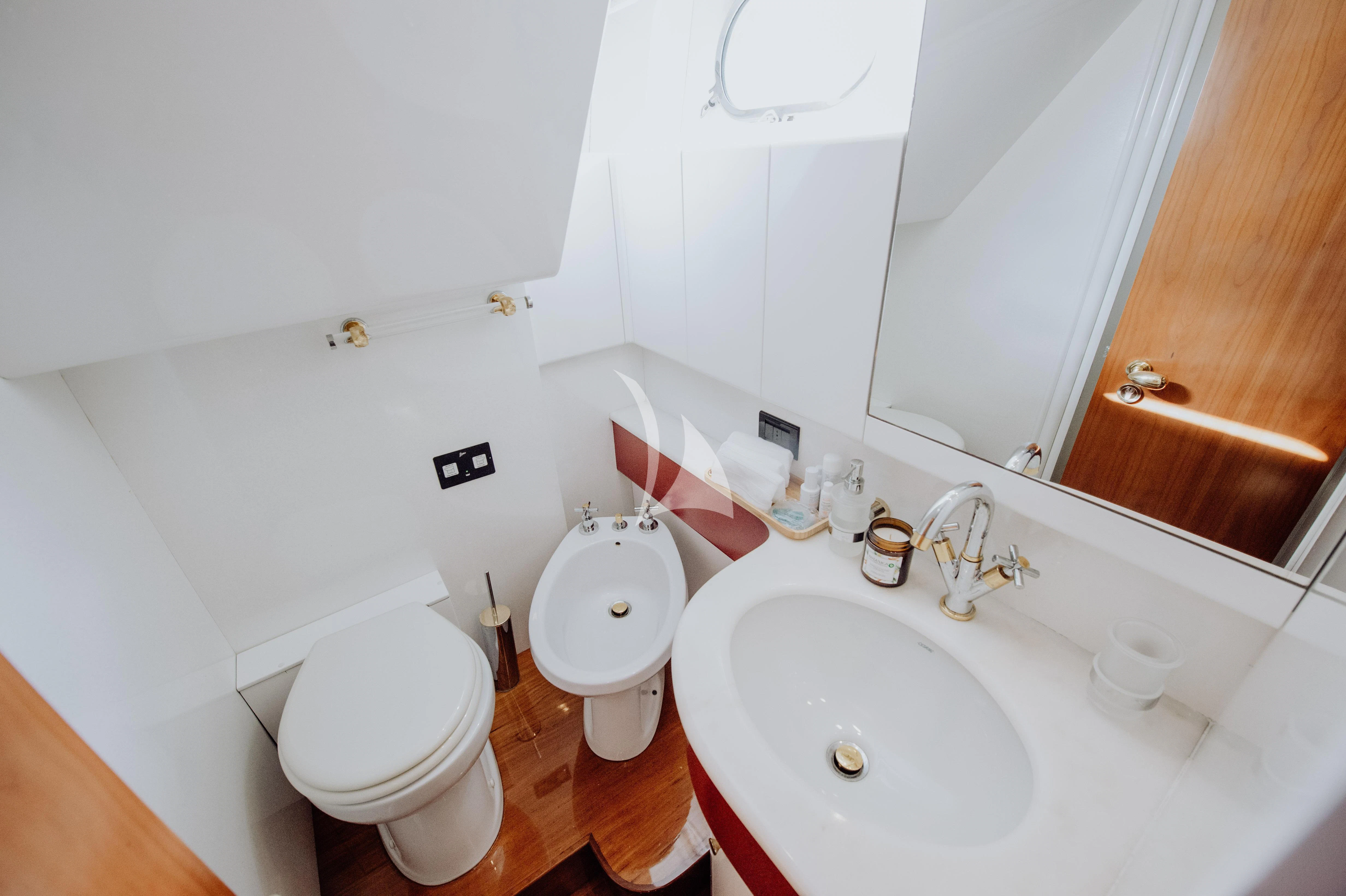 a bathroom with a sink and toilet aboard BEYOND Yacht for Charter