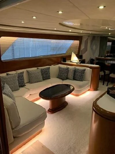 a large living room with a large window aboard BEYOND Yacht for Charter
