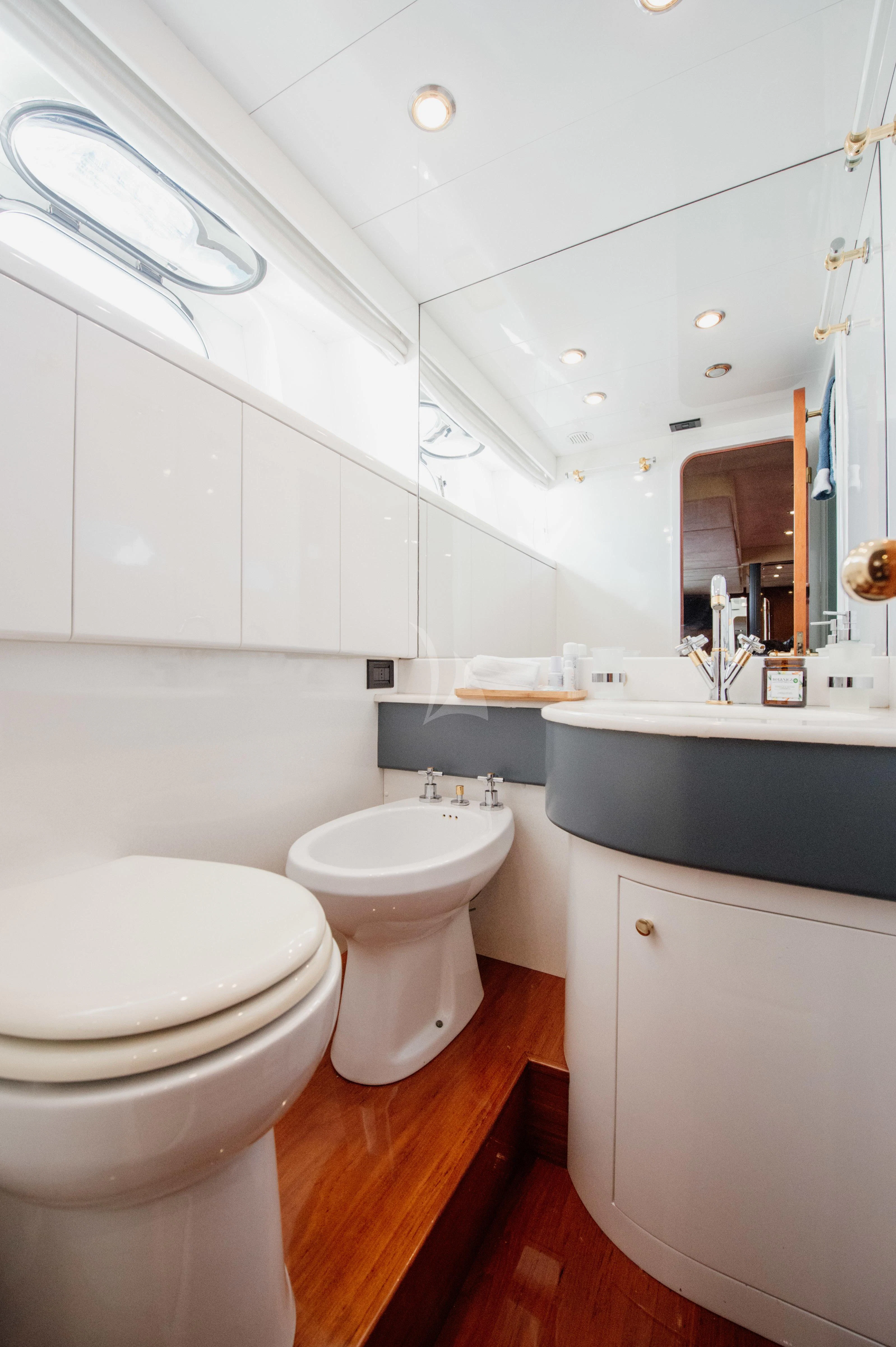 a bathroom with a sink and toilet aboard BEYOND Yacht for Charter