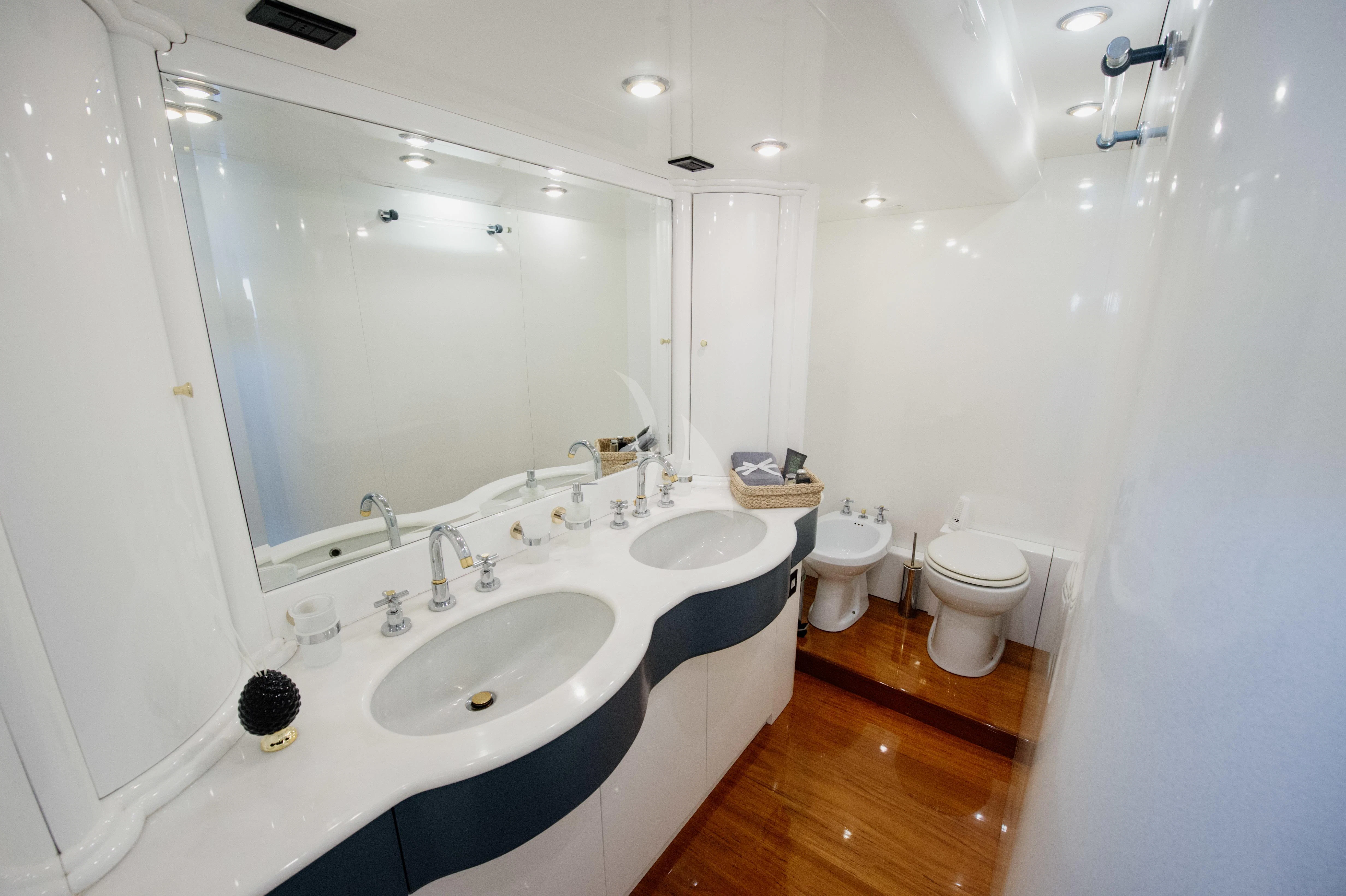 a bathroom with a sink and a toilet aboard BEYOND Yacht for Charter