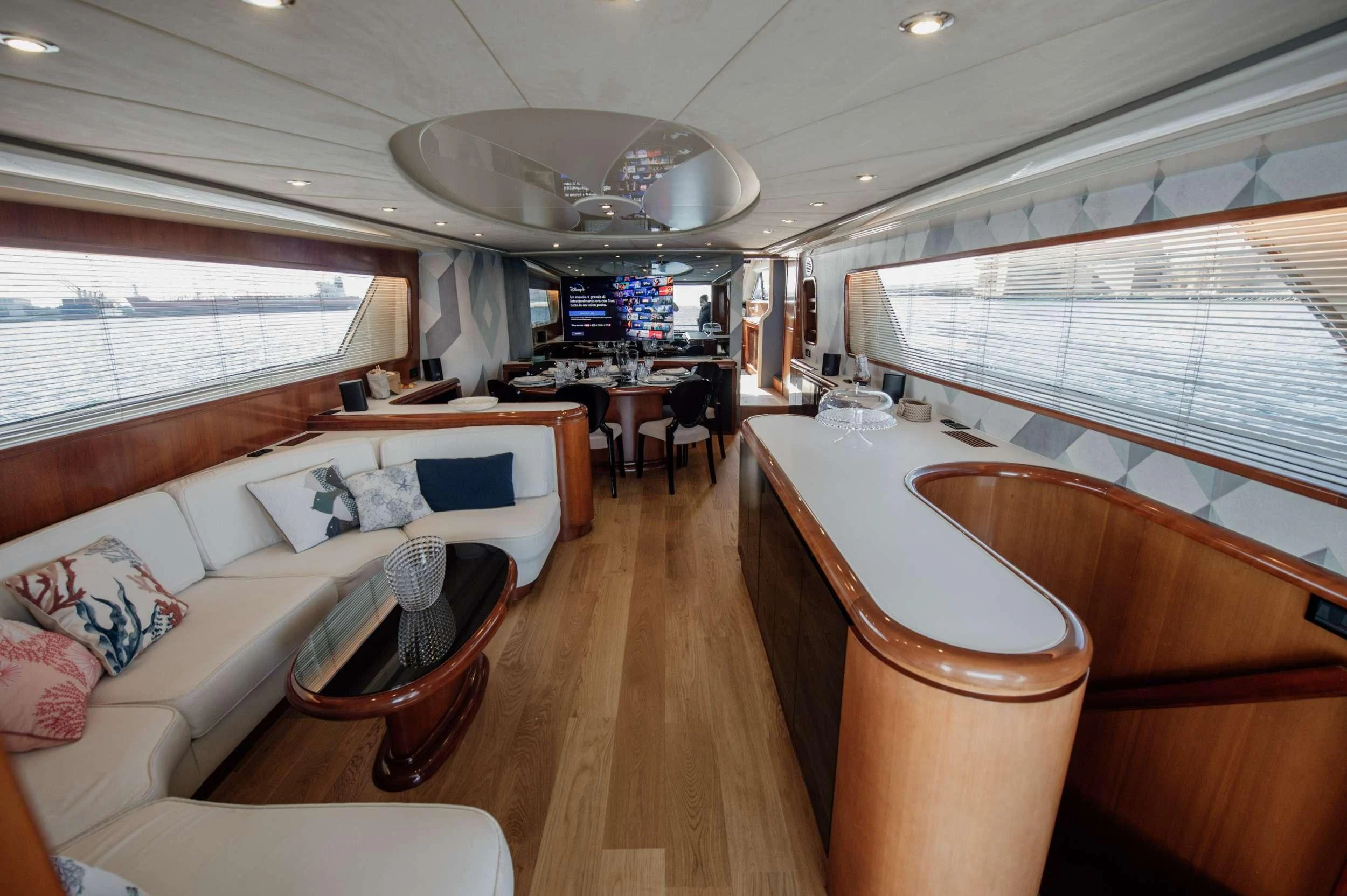 a large living room with a wood floor aboard BEYOND Yacht for Charter