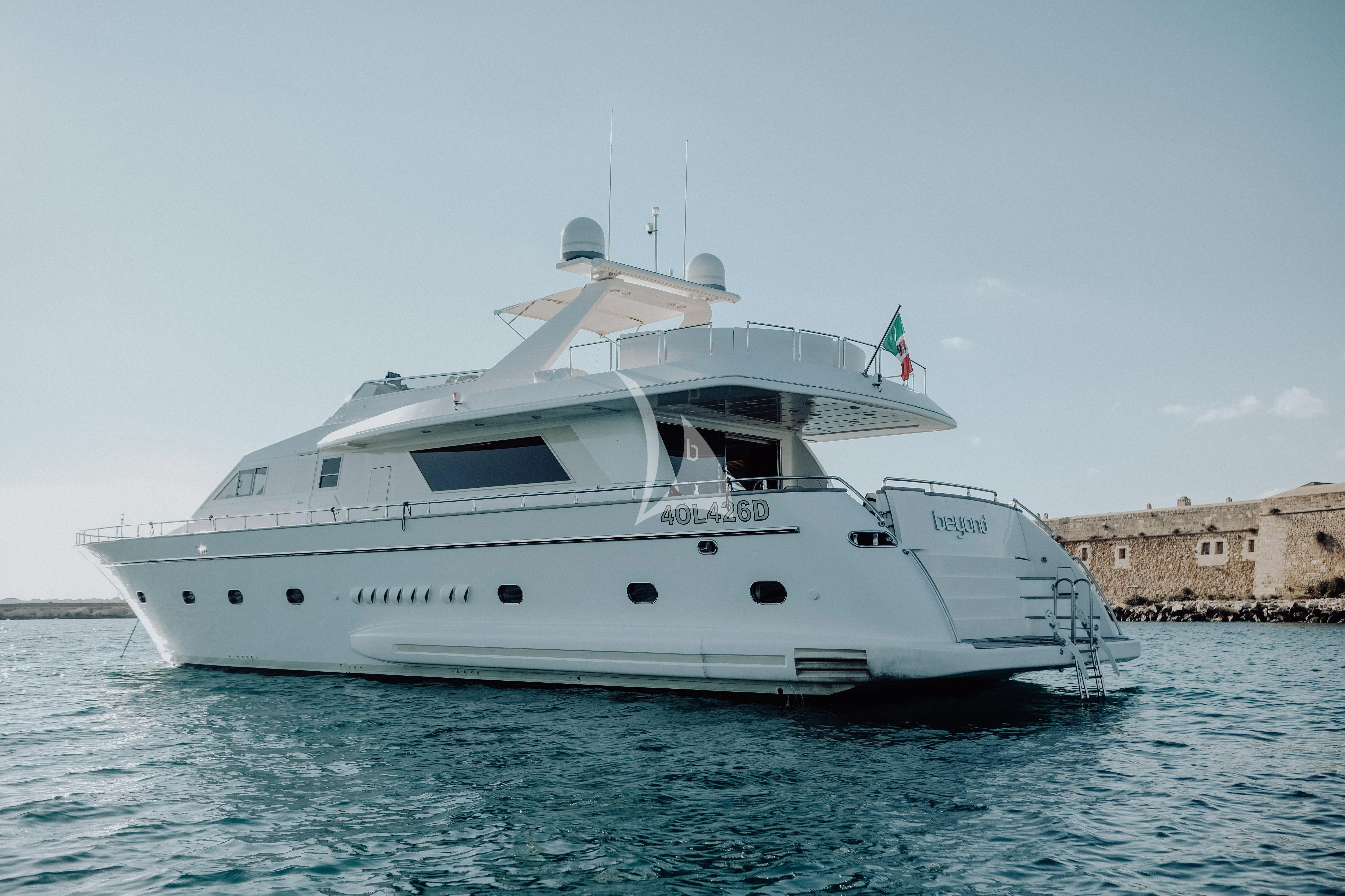 a white boat in the water aboard BEYOND Yacht for Charter