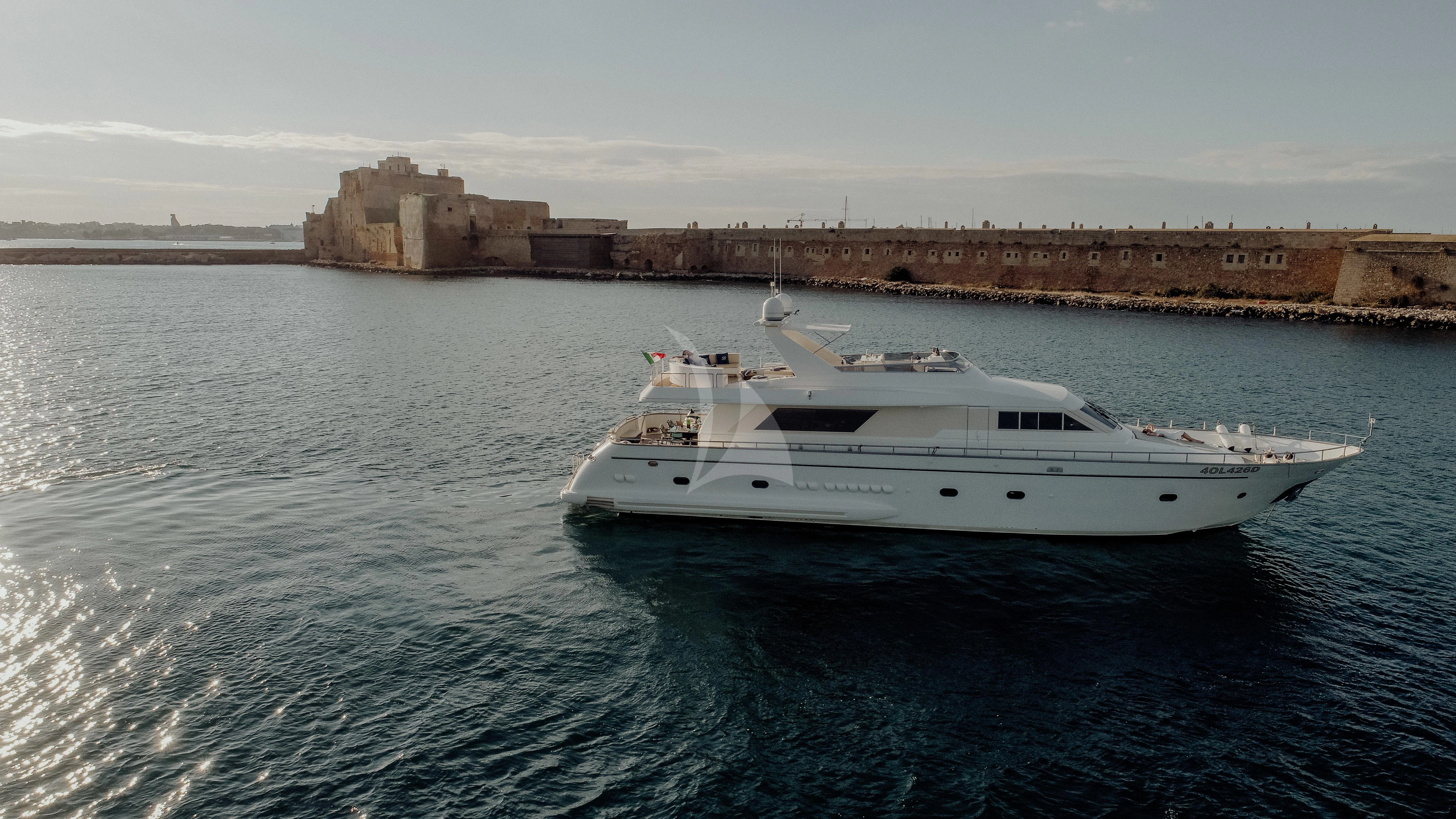 a white boat in the water aboard BEYOND Yacht for Charter