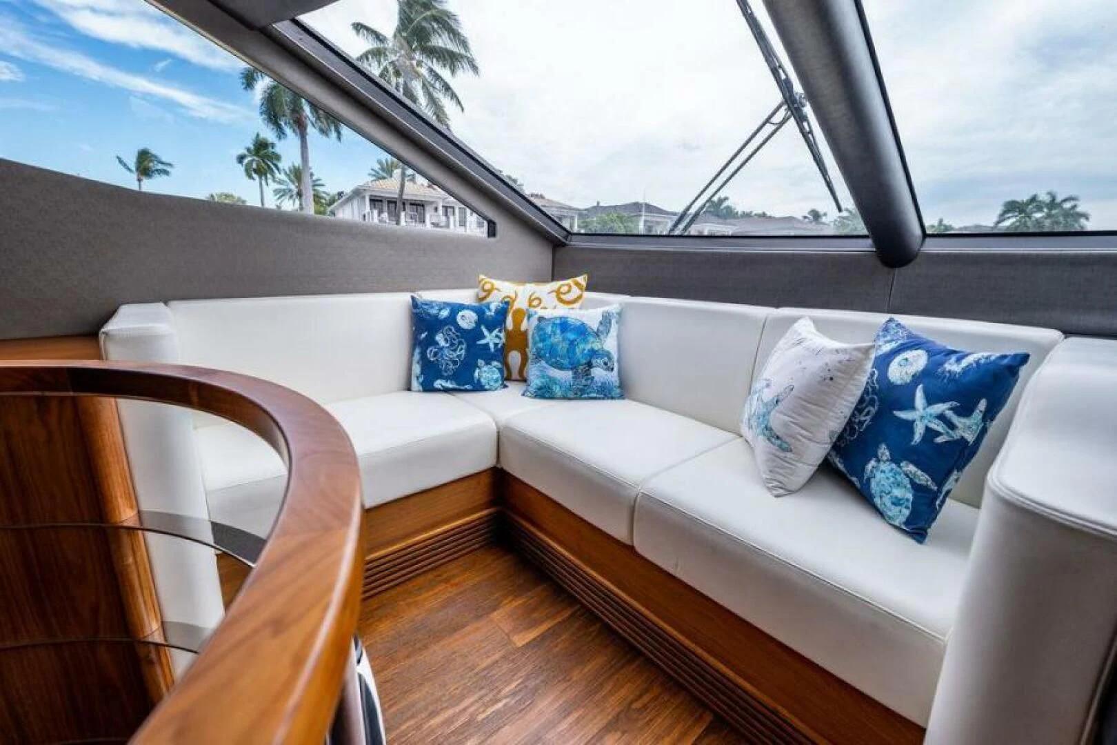 a white couch with blue pillows aboard RAPALLO V Yacht for Sale