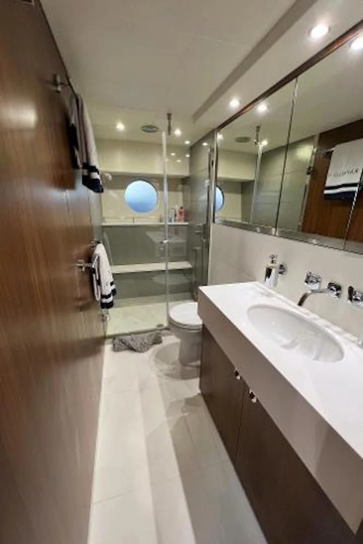 a bathroom with a large mirror aboard RAPALLO V Yacht for Sale