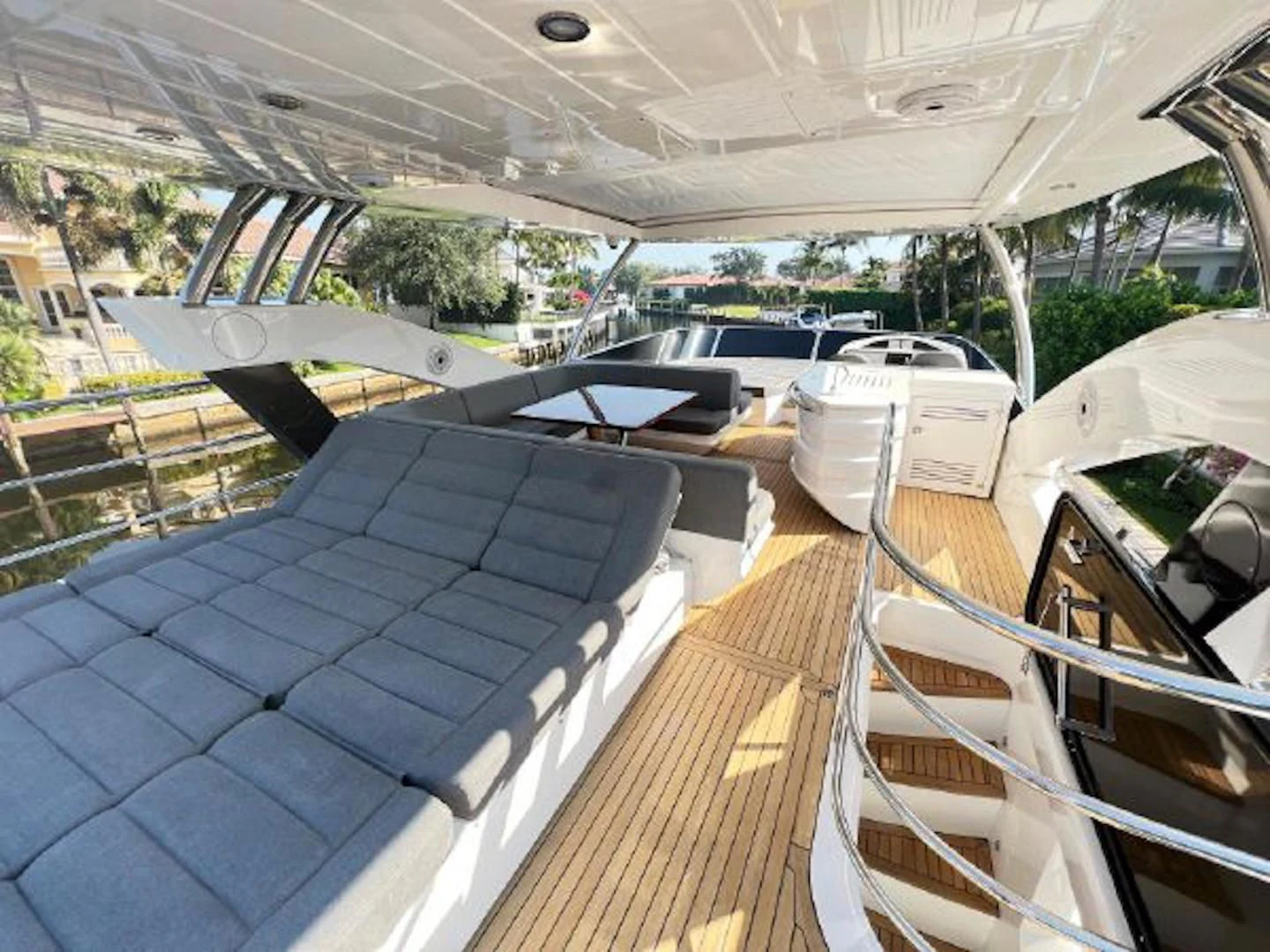 a deck with a table and chairs aboard RAPALLO V Yacht for Sale