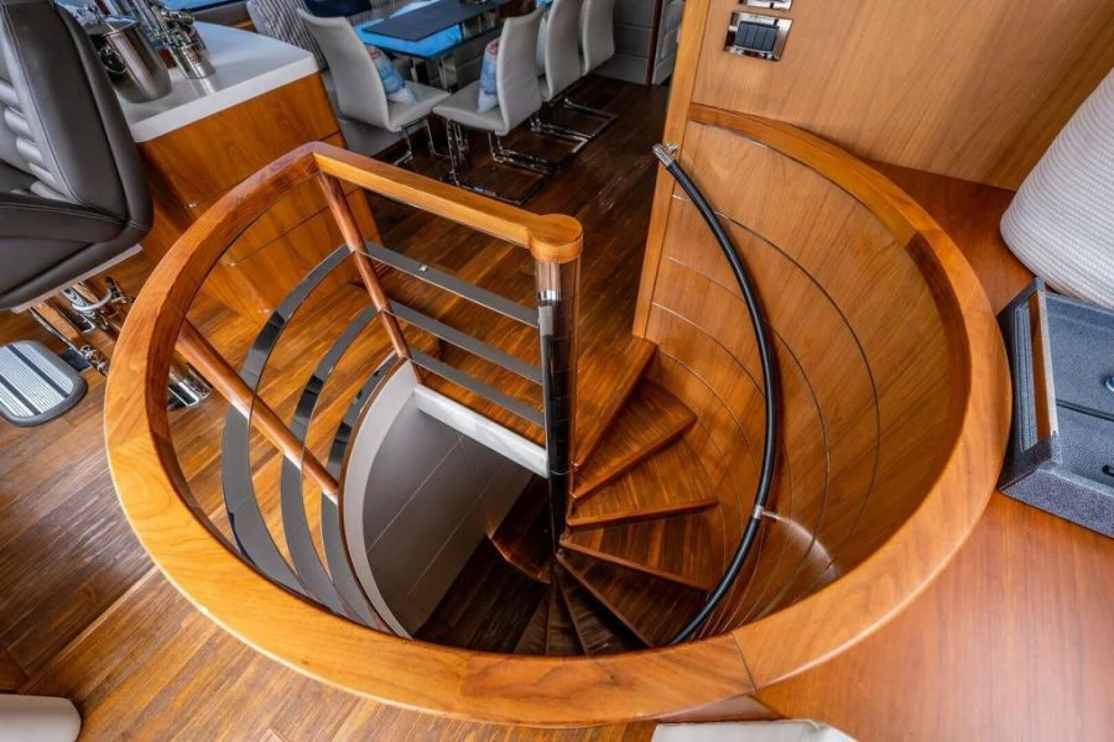 a guitar on a wood floor aboard RAPALLO V Yacht for Sale
