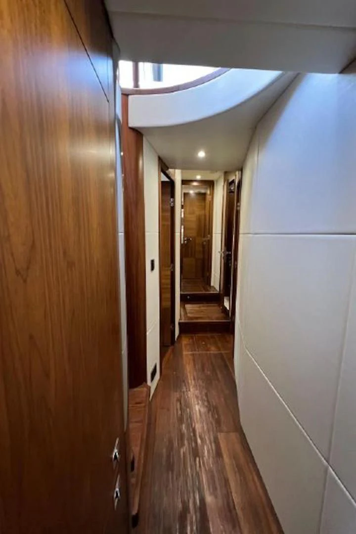 a hallway with a wood floor and white walls aboard RAPALLO V Yacht for Sale