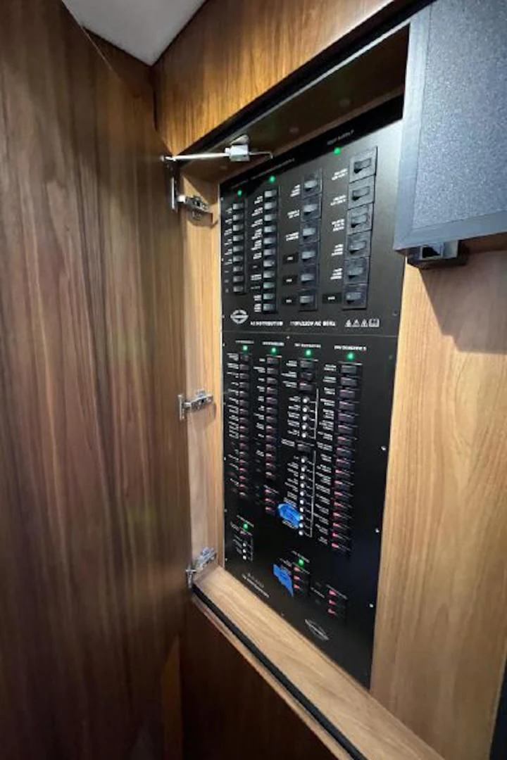 a computer on a wooden cabinet aboard RAPALLO V Yacht for Sale