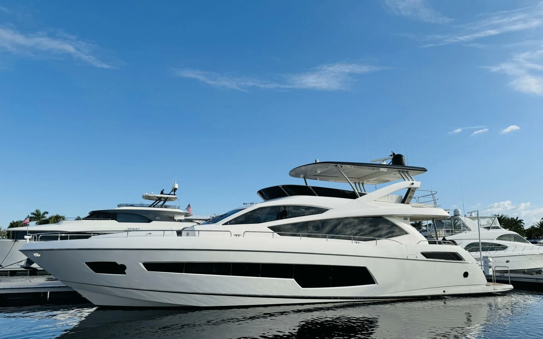 a white yacht on a beach aboard RAPALLO V Yacht for Sale