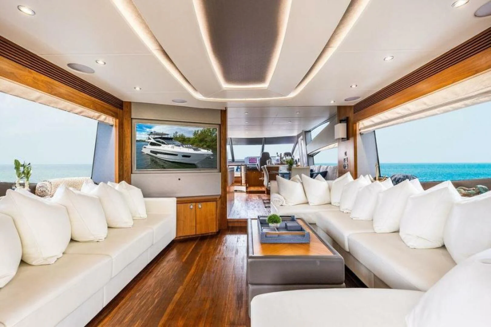 a living room with a large window aboard RAPALLO V Yacht for Sale