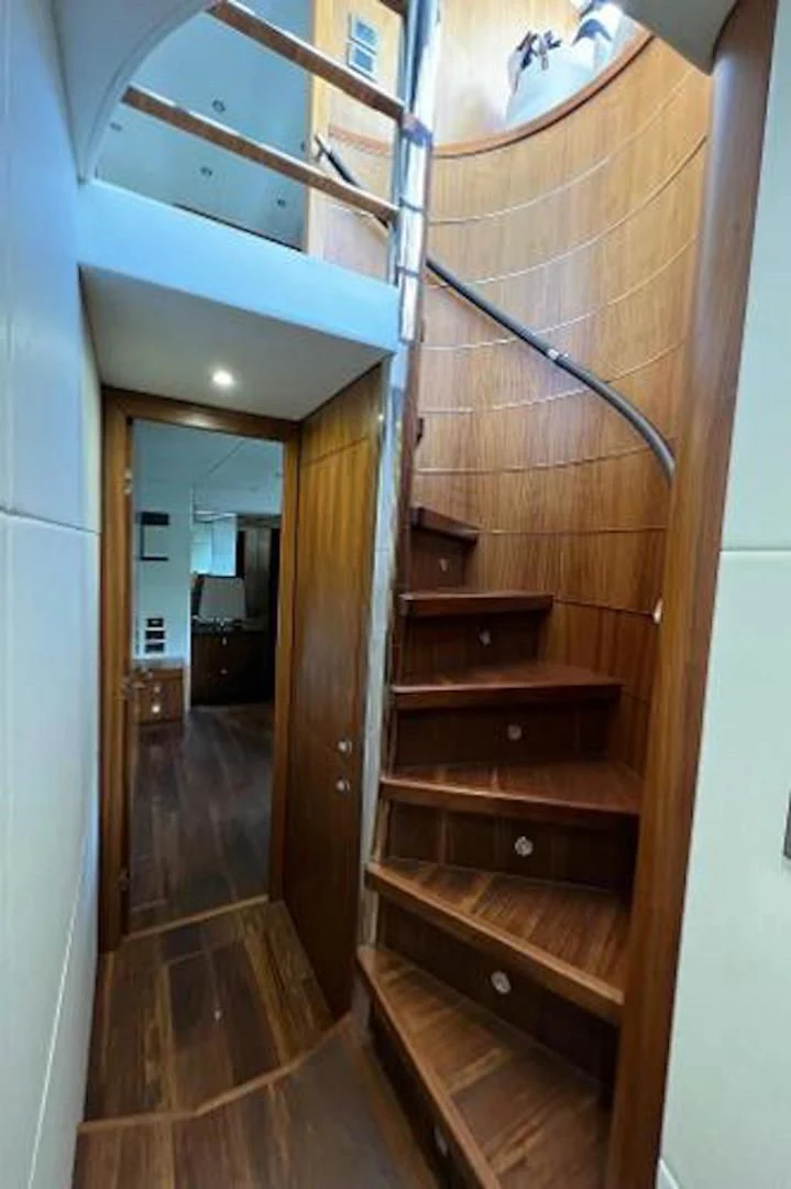 a wood cabinet in a room aboard RAPALLO V Yacht for Sale