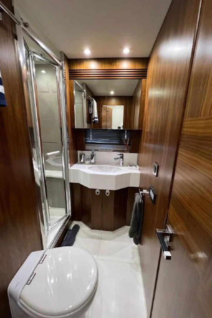 a bathroom with a sink and a mirror aboard RAPALLO V Yacht for Sale