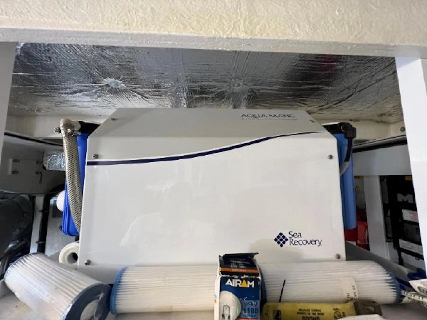 a white cylinder with a blue line aboard RAPALLO V Yacht for Sale