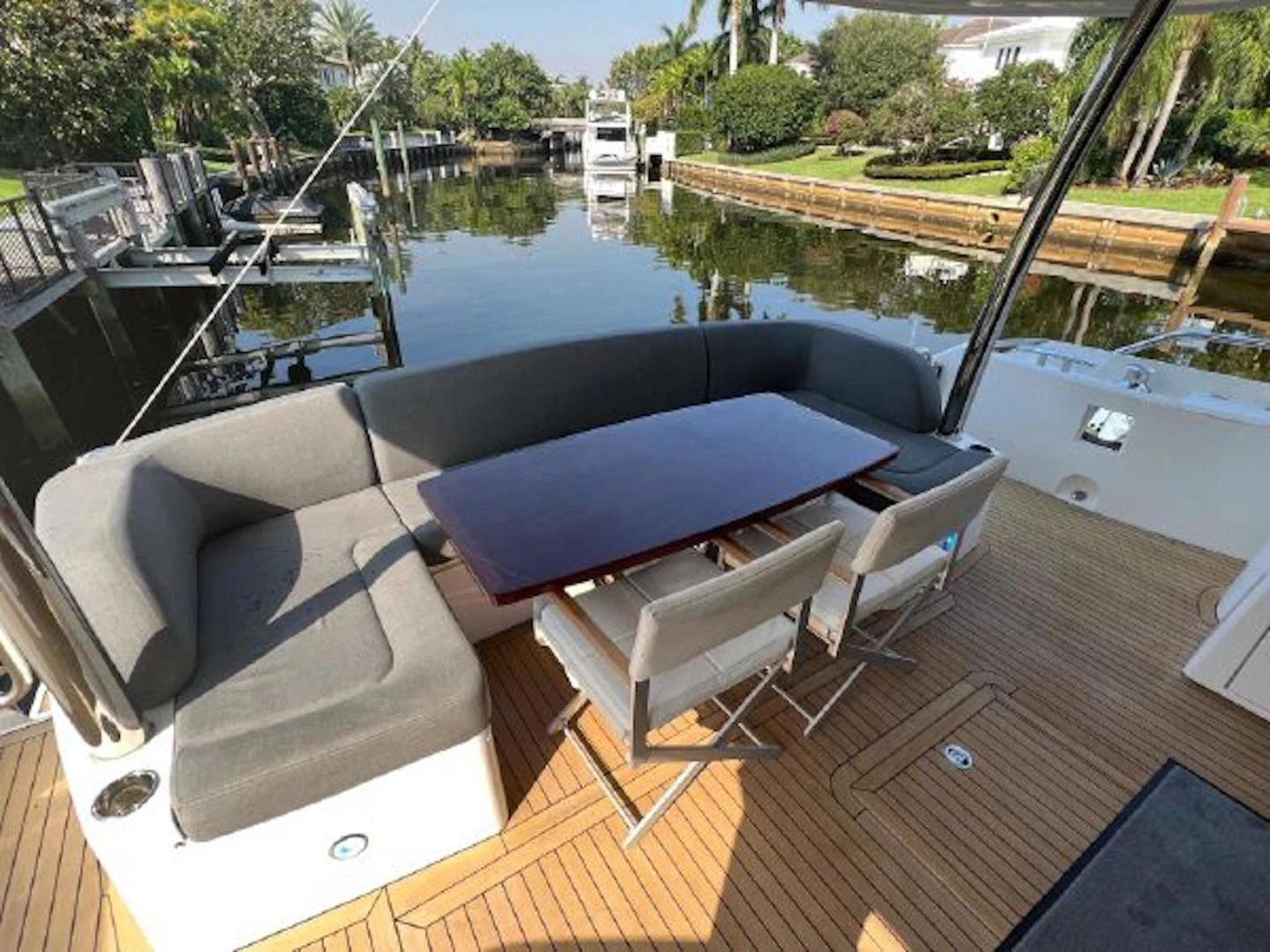 a large swimming pool with chairs around it aboard RAPALLO V Yacht for Sale