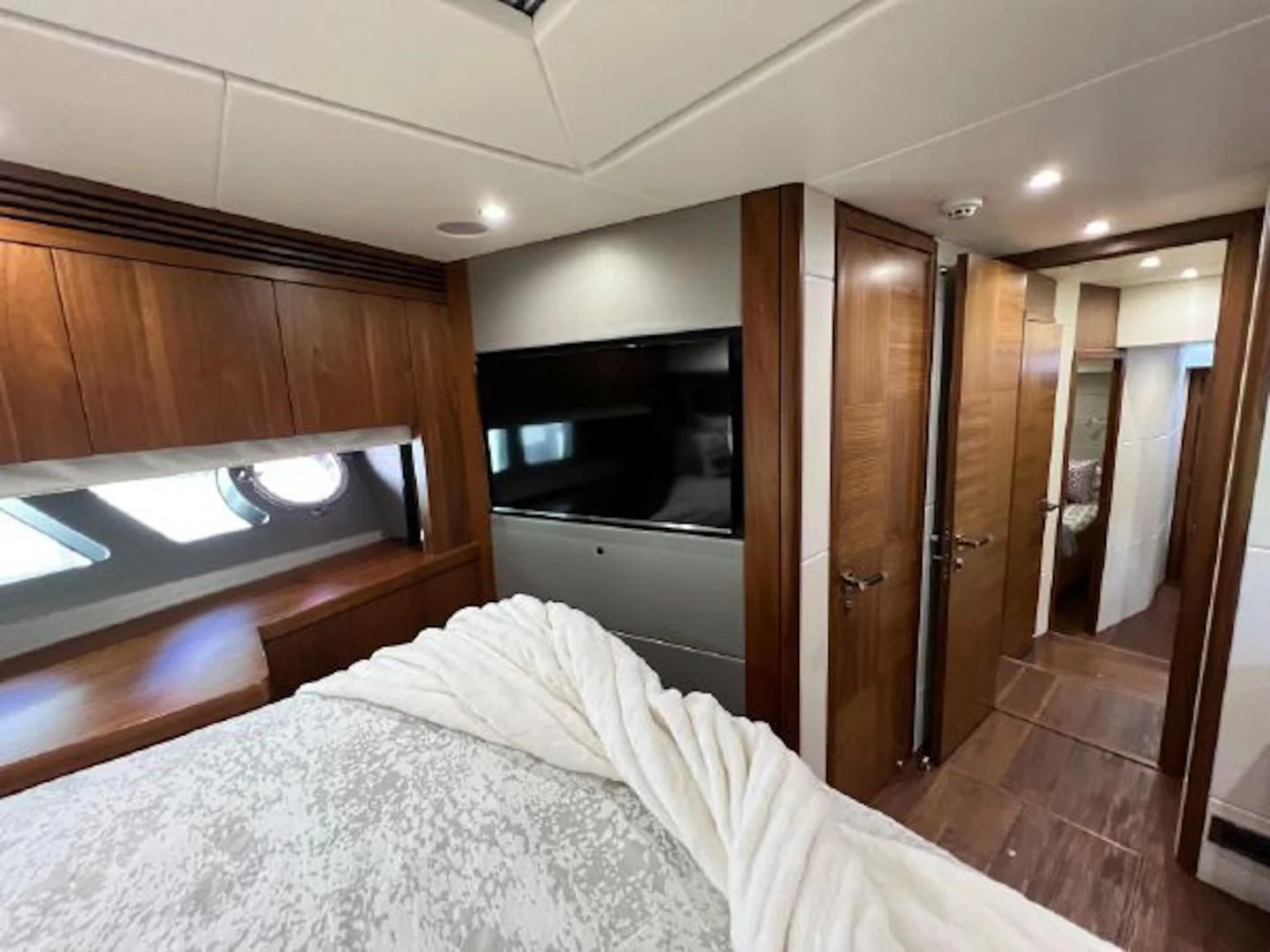 a bedroom with a bed and a closet aboard RAPALLO V Yacht for Sale