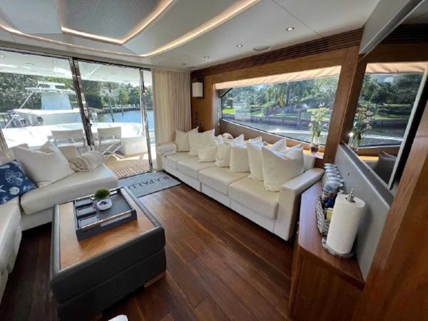 a living room with a large window aboard RAPALLO V Yacht for Sale