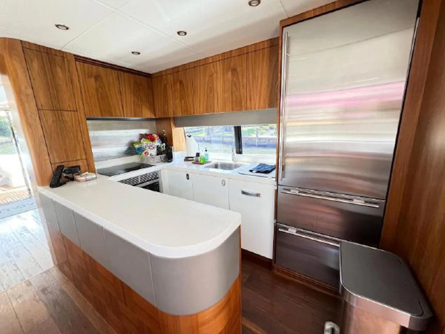 a kitchen with a large window aboard RAPALLO V Yacht for Sale