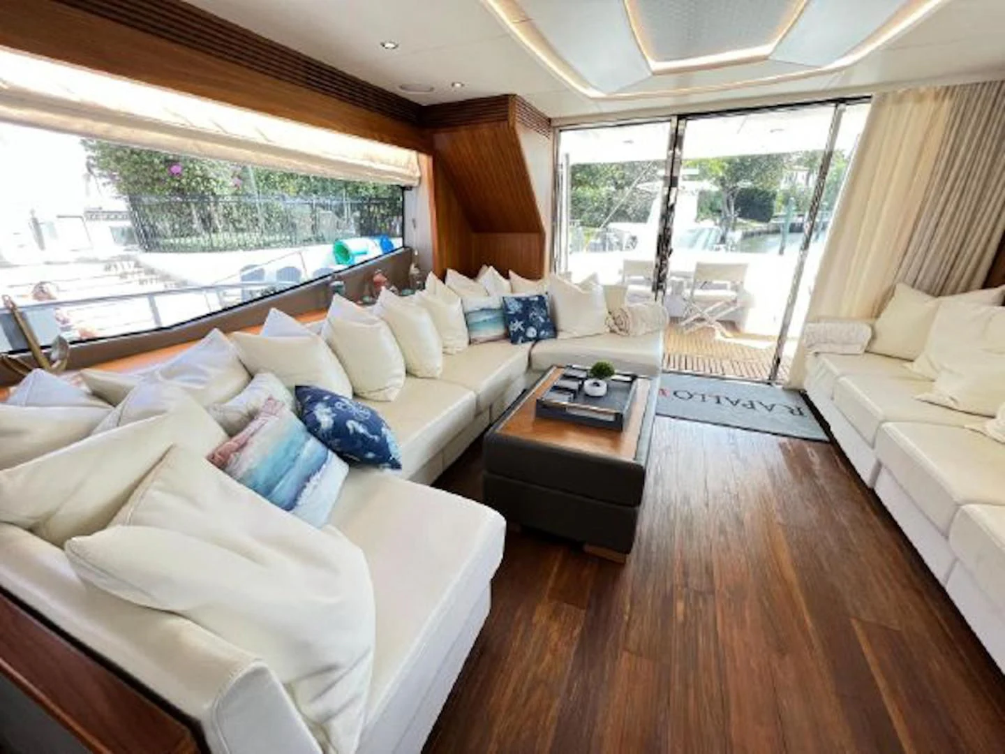 a living room with a large window aboard RAPALLO V Yacht for Sale