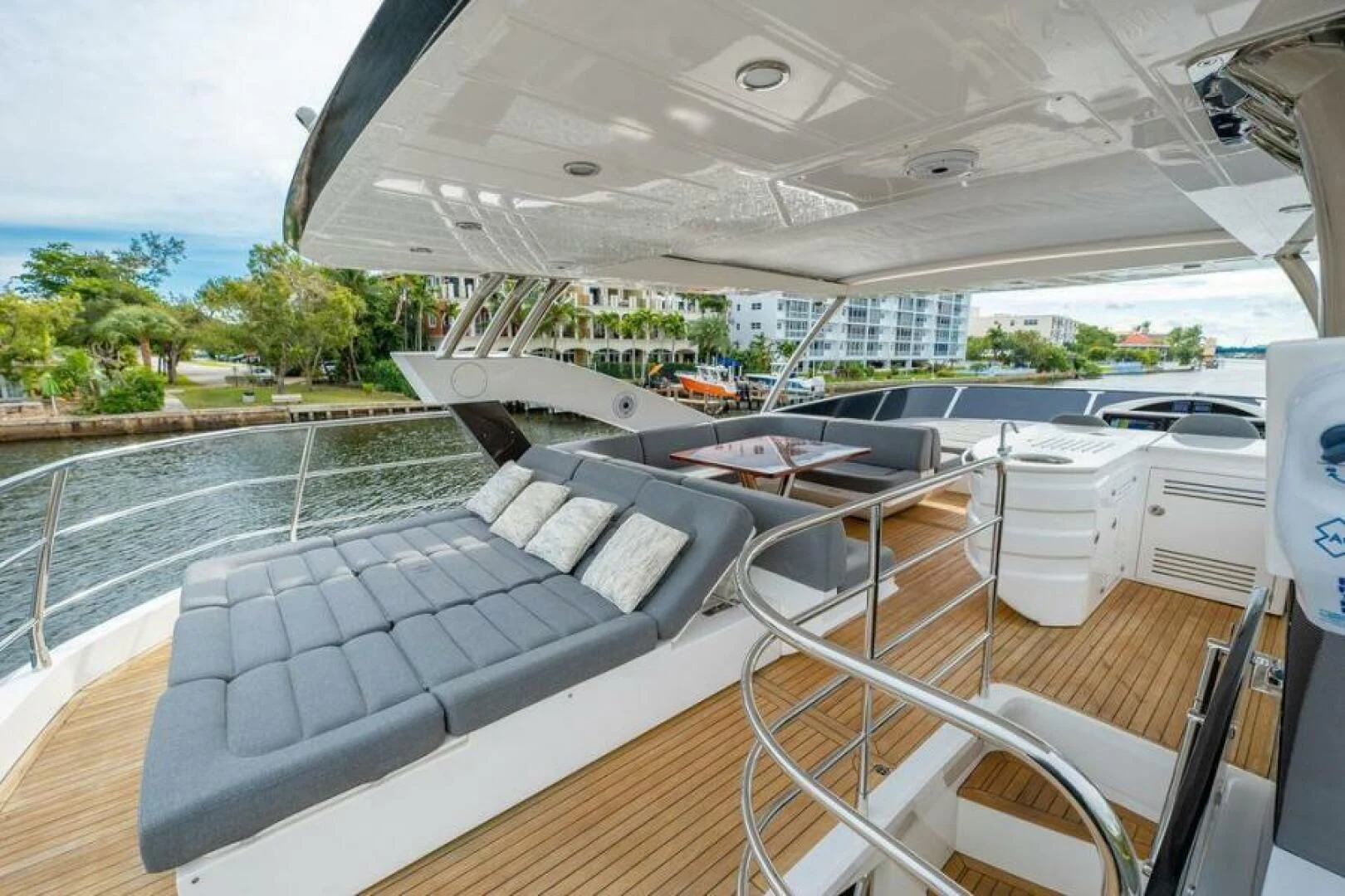 a deck with a deck and a pool aboard RAPALLO V Yacht for Sale