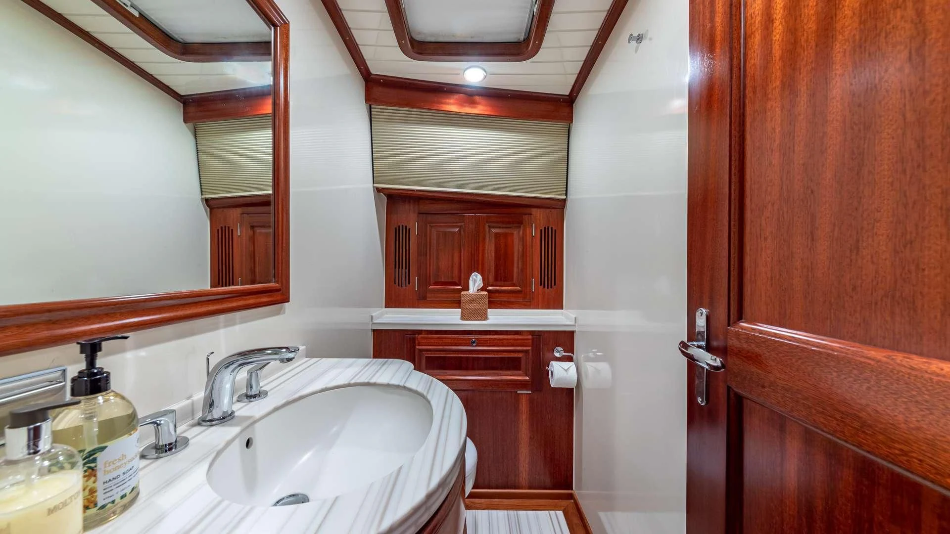 a bathroom with a sink and cabinets aboard FALCON Yacht for Sale