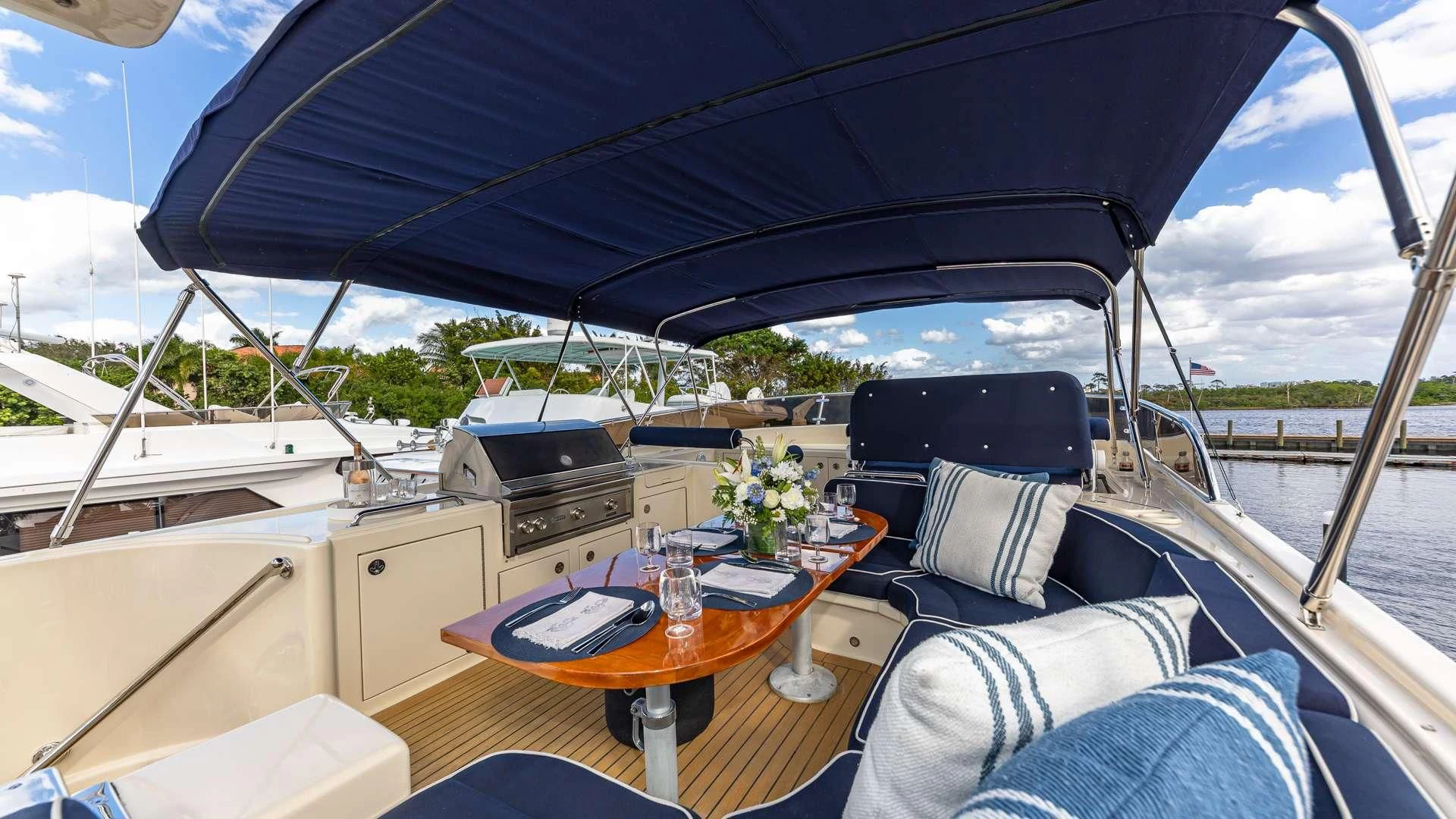 a tent with a table and chairs aboard FALCON Yacht for Sale
