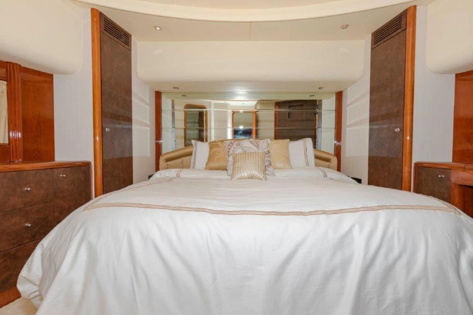 a bed with white sheets aboard EL FARAON Yacht for Sale