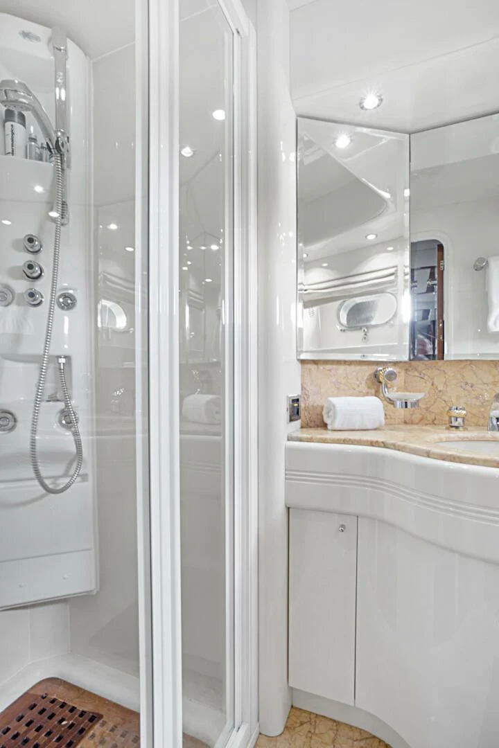 a bathroom with a shower unit and sink aboard EL FARAON Yacht for Sale
