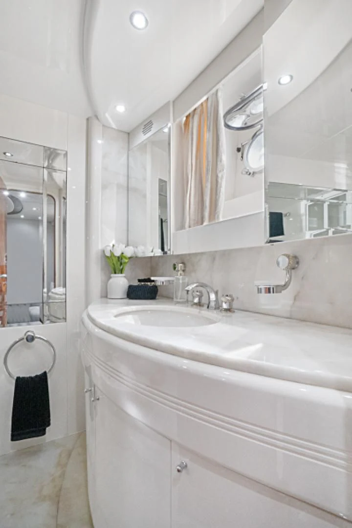 a bathroom with a sink and a mirror aboard EL FARAON Yacht for Sale