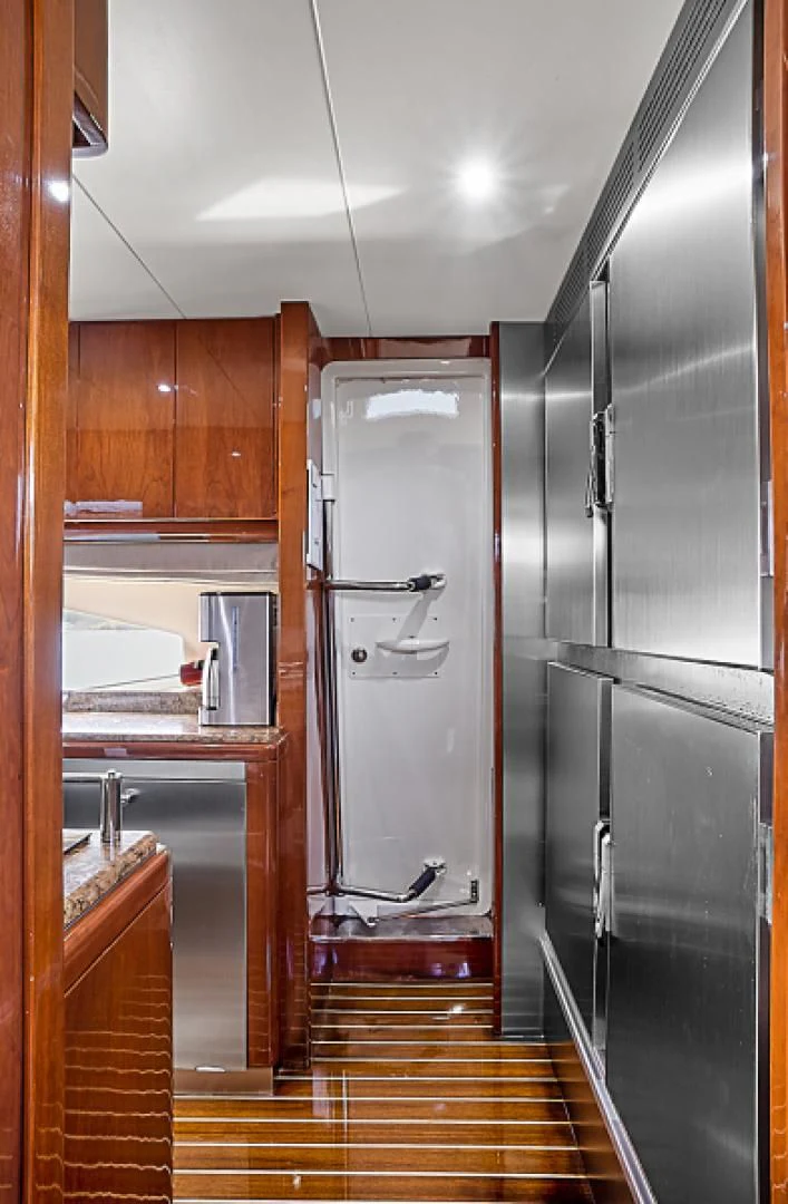 a large stainless steel refrigerator in a kitchen aboard EL FARAON Yacht for Sale