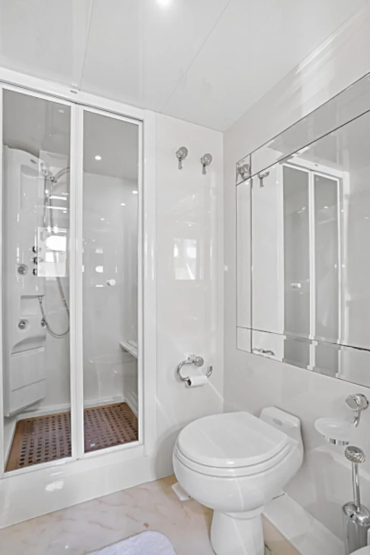 a bathroom with a glass shower aboard EL FARAON Yacht for Sale