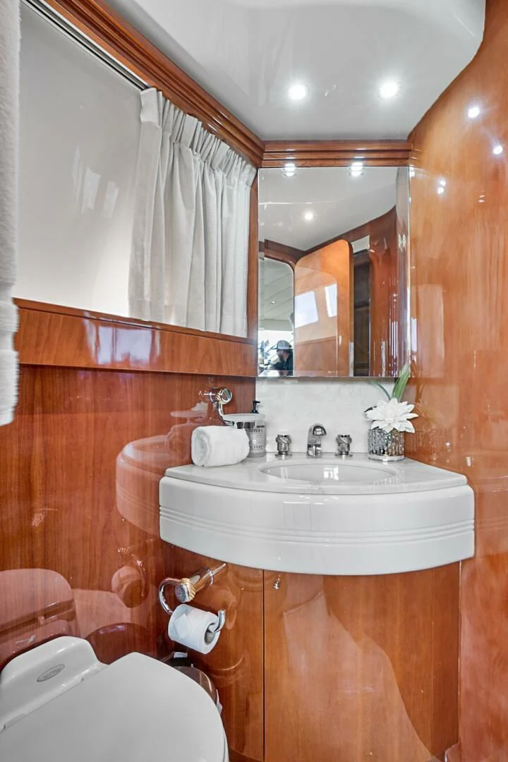 a bathroom with a sink and a mirror aboard EL FARAON Yacht for Sale