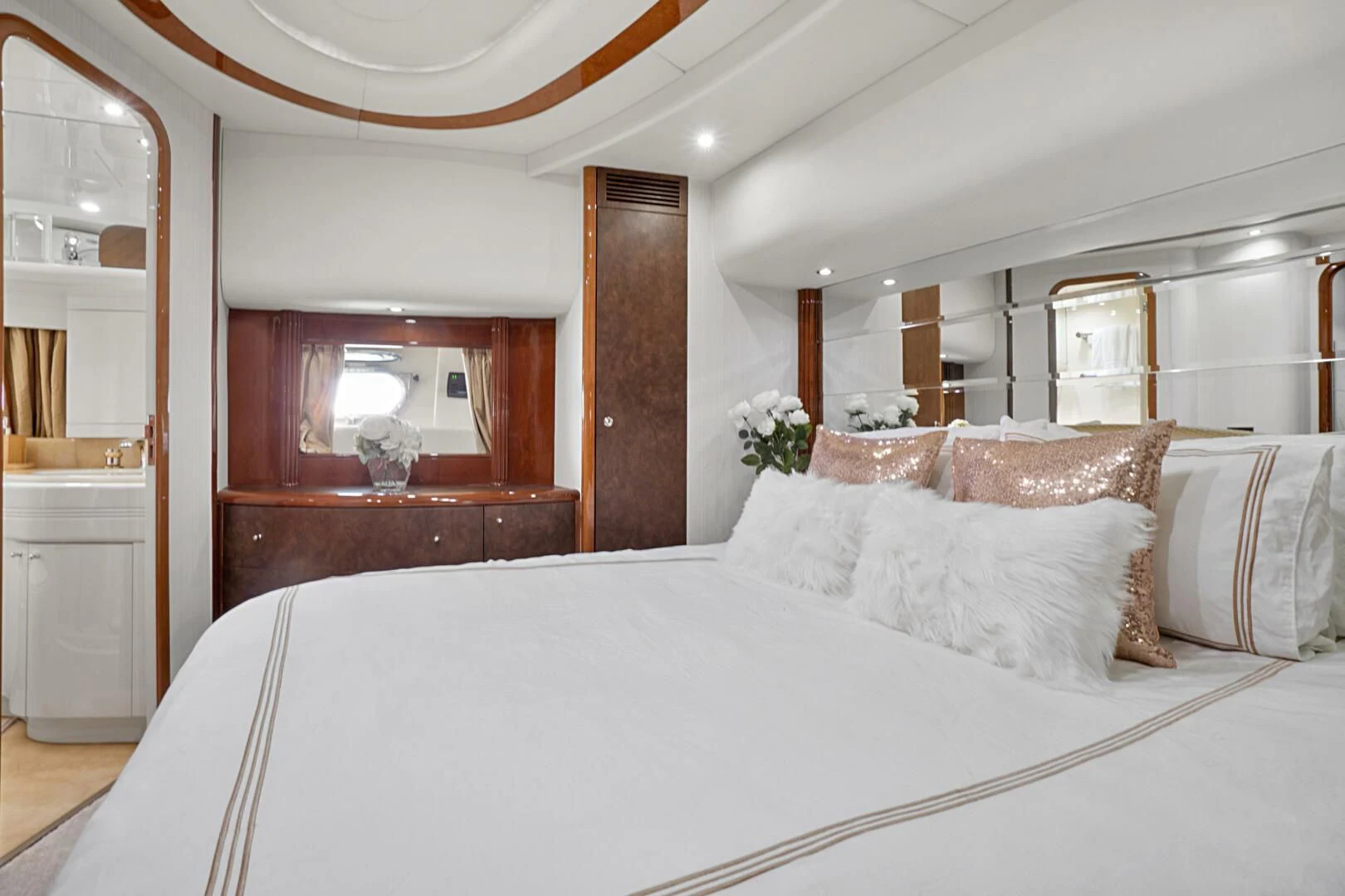 a bed with white sheets aboard EL FARAON Yacht for Sale