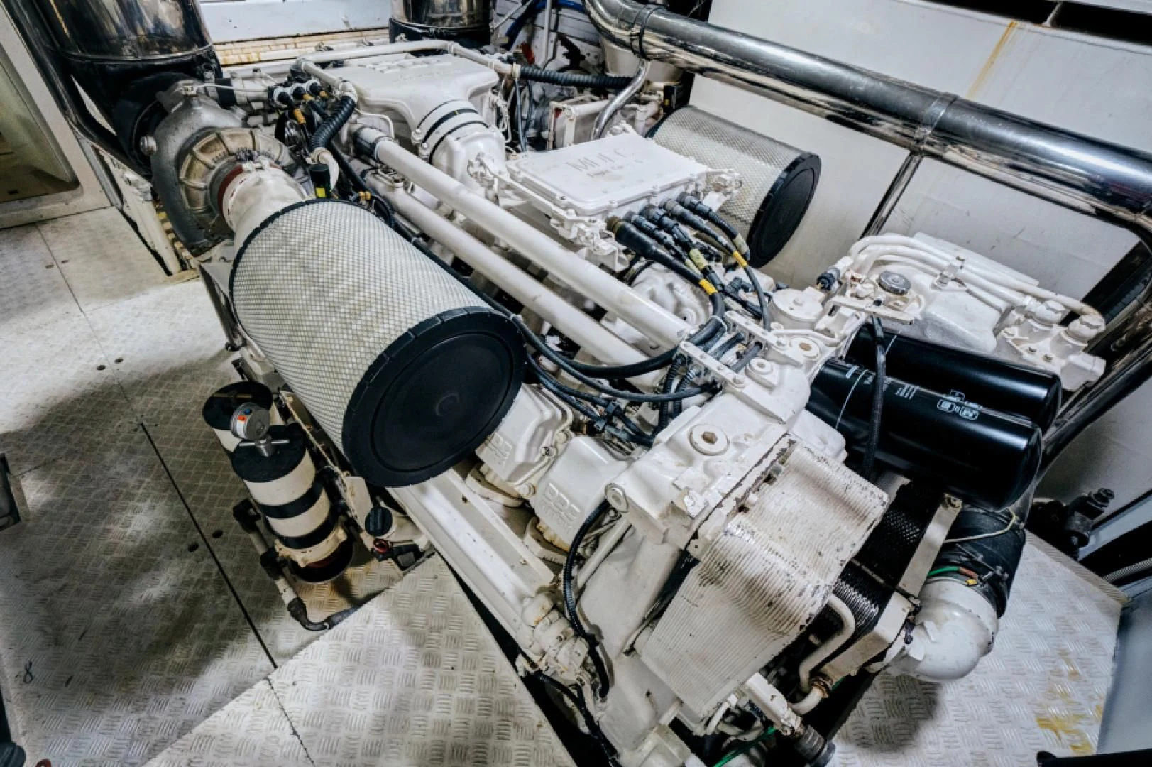 a car engine with a white hood aboard EL FARAON Yacht for Sale