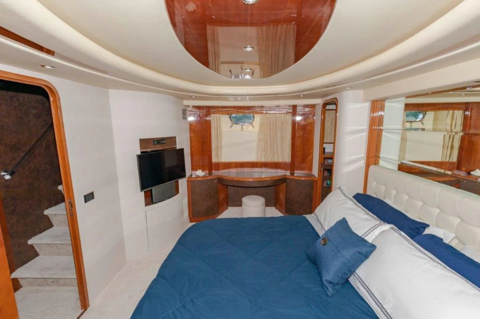 a room with a bed and a television aboard EL FARAON Yacht for Sale