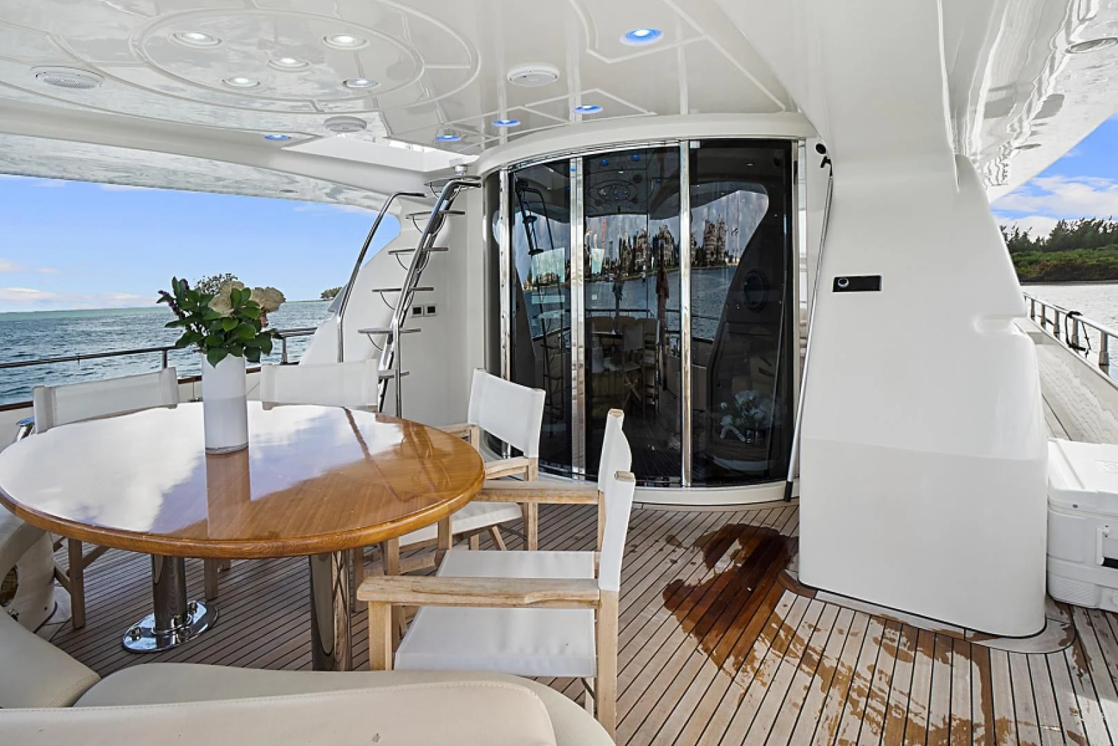 a table and chairs on a deck aboard EL FARAON Yacht for Sale