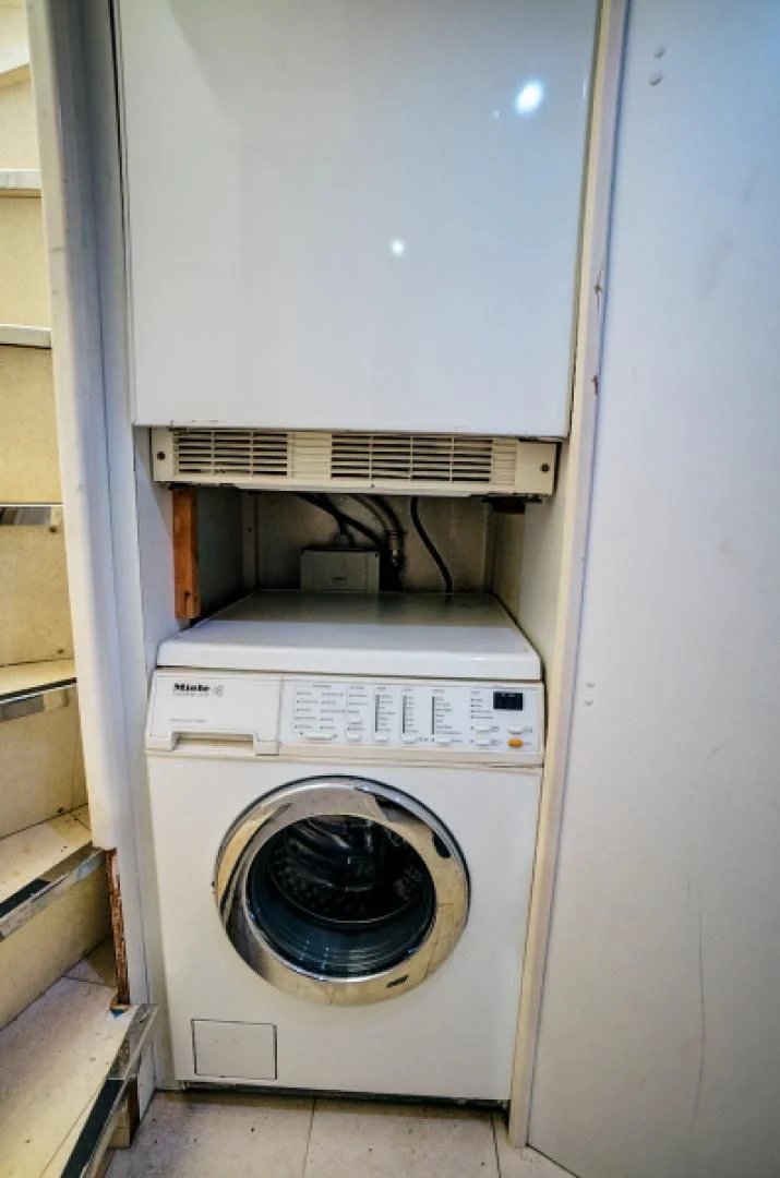 a washing machine in a room aboard EL FARAON Yacht for Sale