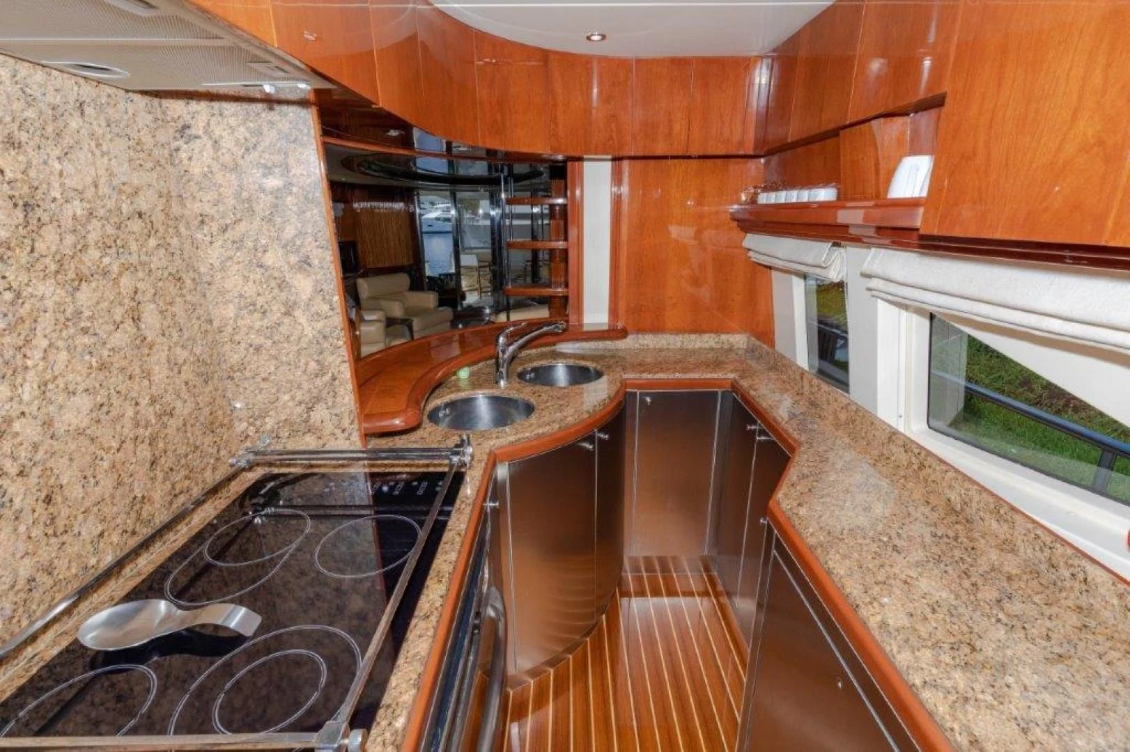 a kitchen with wooden cabinets aboard EL FARAON Yacht for Sale