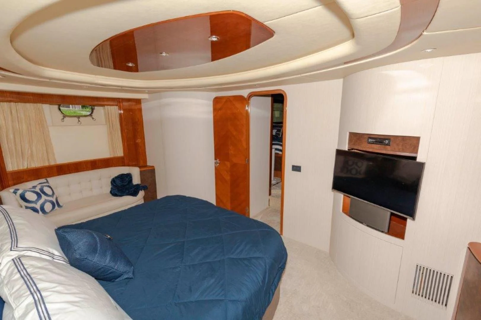 a room with a bed and a television aboard EL FARAON Yacht for Sale