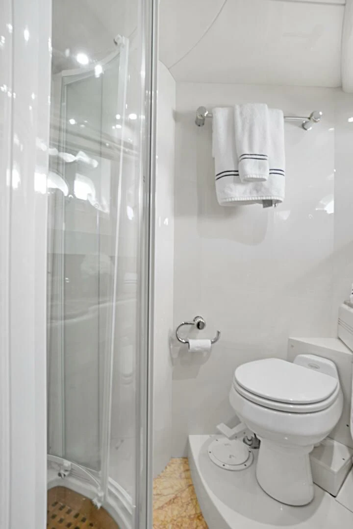 a bathroom with a glass shower door aboard EL FARAON Yacht for Sale