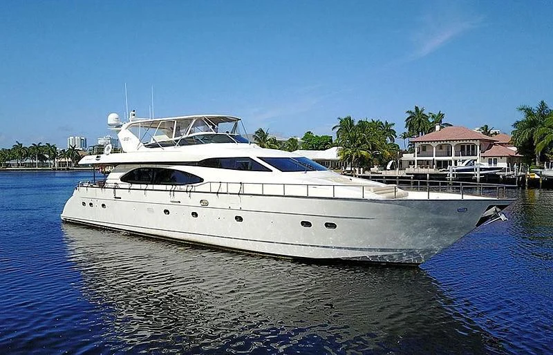 a white yacht docked at a pier aboard EL FARAON Yacht for Sale