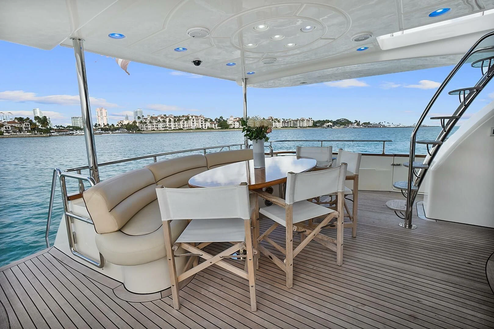 a table and chairs on a deck aboard EL FARAON Yacht for Sale