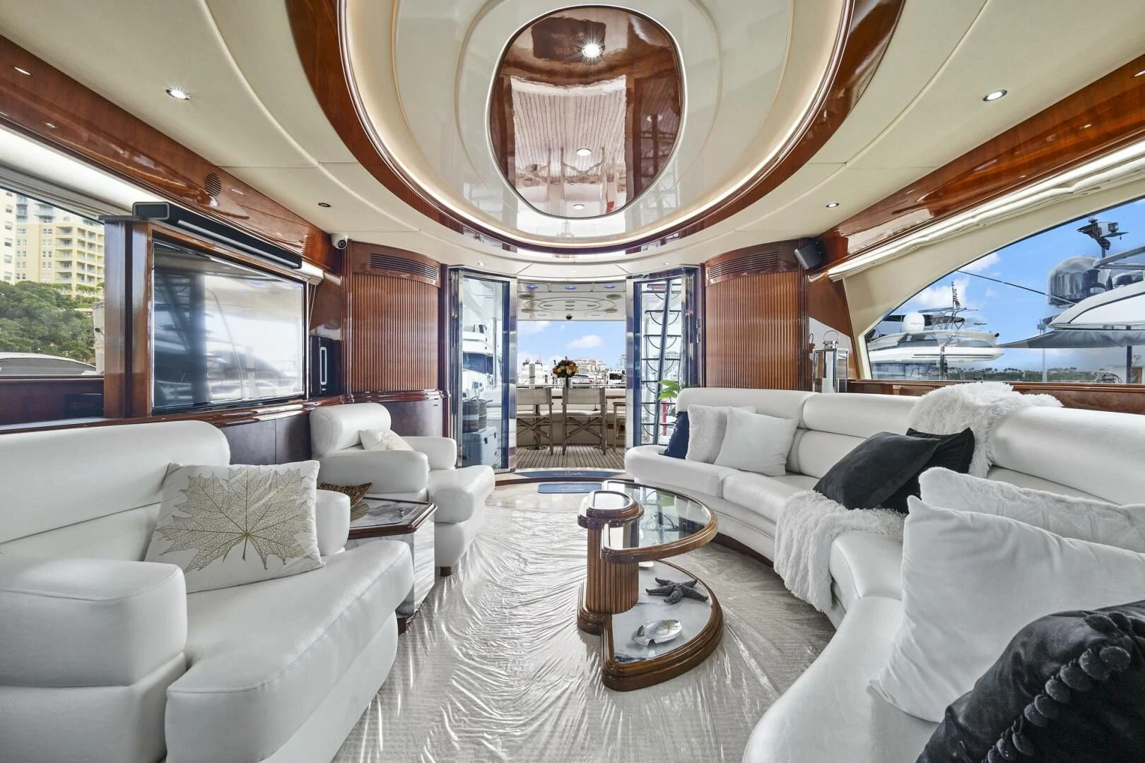a living room with a large mirror aboard EL FARAON Yacht for Sale
