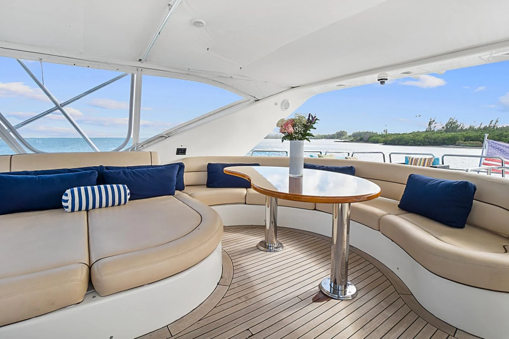 a room with a table and couches aboard EL FARAON Yacht for Sale