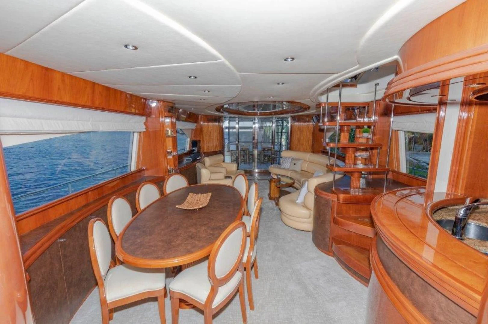 a dining room with a large window aboard EL FARAON Yacht for Sale