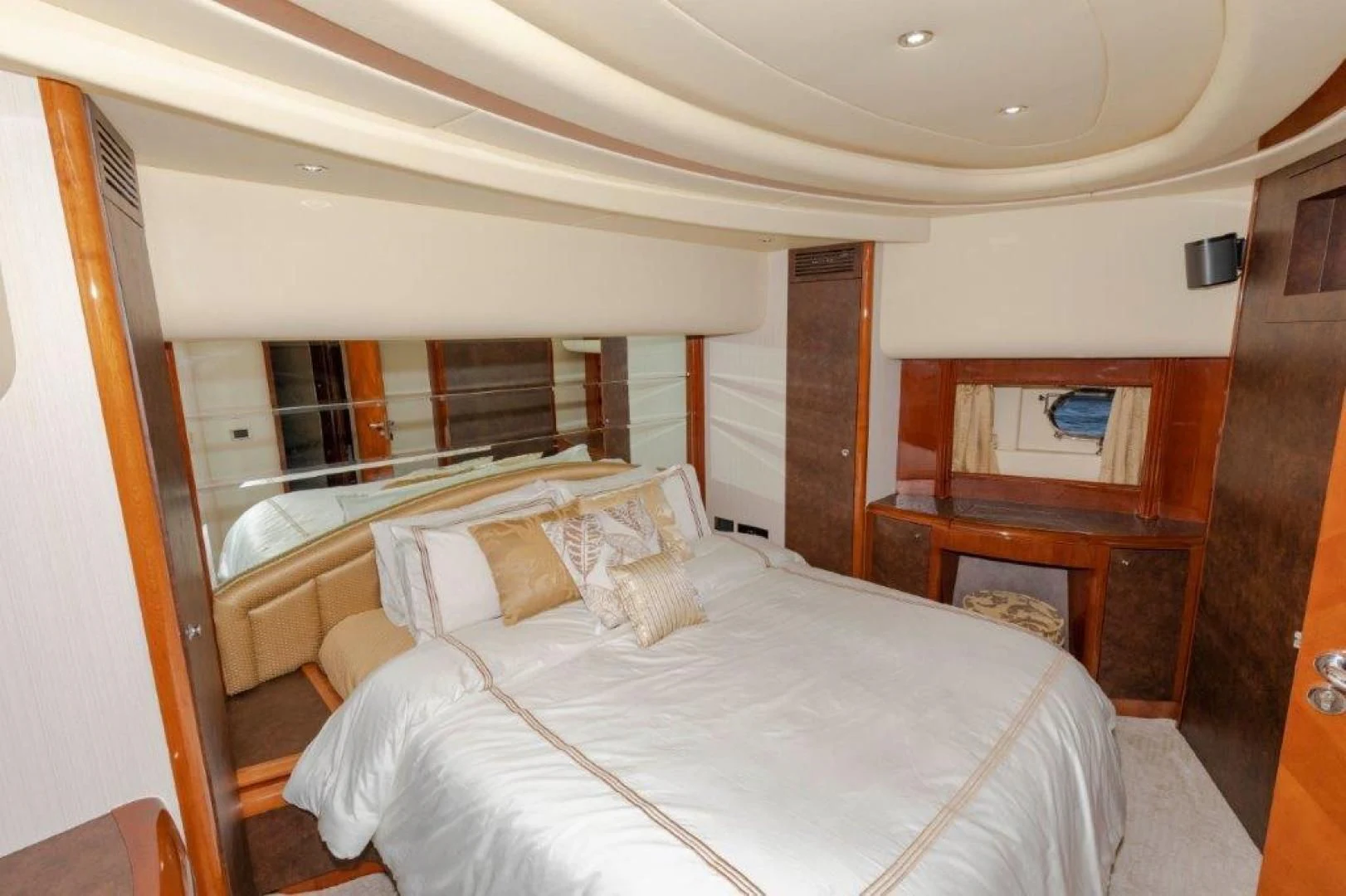 a room with a bed and a mirror aboard EL FARAON Yacht for Sale